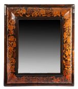 An impressive and large William & Mary walnut and marquetry-inlaid mirror, circa 1700 The bold