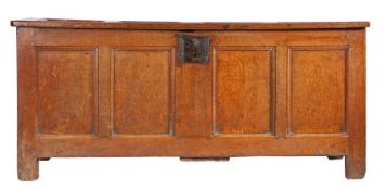 An Elizabeth I joined oak coffer, circa 1590 The quadruple panelled hinged lid and front each