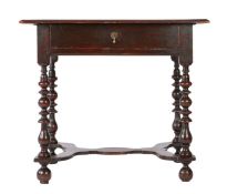 A William & Mary oak side table, circa 1690 Having a triple-boarded ovolo-moulded top, single frieze