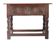An Elizabeth I oak box-top table, circa 1600 Having a boarded hinged top with ovolo-moulded edge,