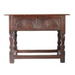 An Elizabeth I oak box-top table, circa 1600 Having a boarded hinged top with ovolo-moulded edge,