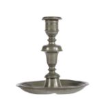 A late 17th century pewter candlestick, Dutch, circa 1690 Having a moulded socket, acorn-knop and