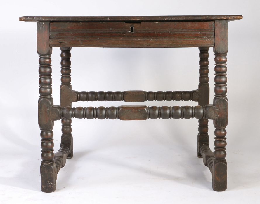 A Charles II oak side table, circa 1670 Having a boarded top with ovolo-moulded edge, and flat run- - Image 3 of 4