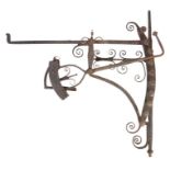 An early 18th century wrought iron chimney crane, English With ten positions, decorative