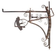 An early 18th century wrought iron chimney crane, English With ten positions, decorative