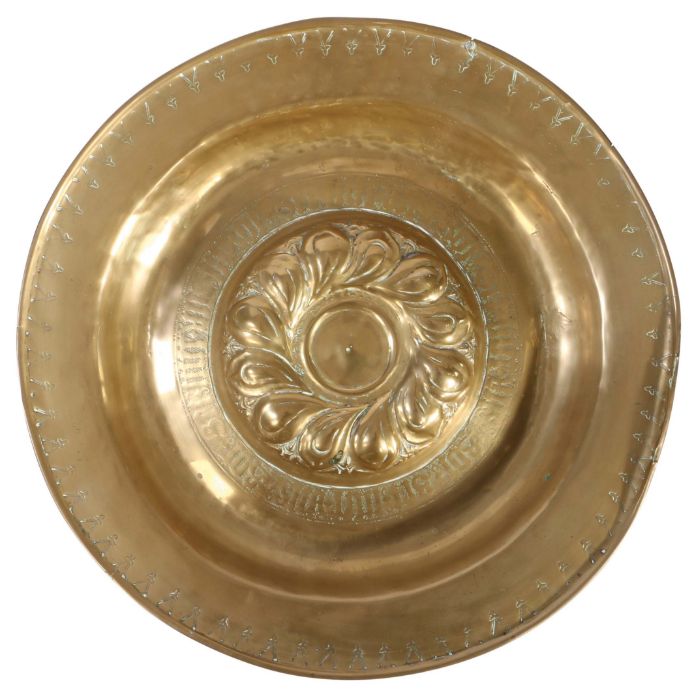 A mid-16th century brass alms dish, Nuremberg, circa 1550 The central boss of twelve double-