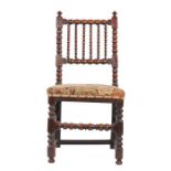 A Charles II oak ball-turned side chair, circa 1670 The back of six ball-turned spindles, held by