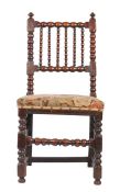 A Charles II oak ball-turned side chair, circa 1670 The back of six ball-turned spindles, held by