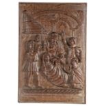An interesting carved oak figural panel, circa 1600-20 Designed as a Nativity scene, with Magi,
