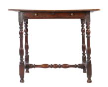 A William & Mary oak side table, circa 1690 The ovolo-moulded top formed mainly from one wide board,