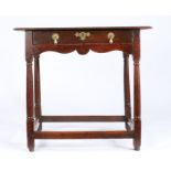 A small George I oak, fruitwood and walnut side table, circa 1720 The twin-plank ovolo-moulded top