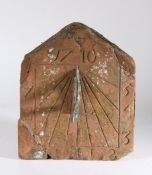 An early 18th century sandstone sundial, dated 1710 Of rectangular pediment form, with pierced metal