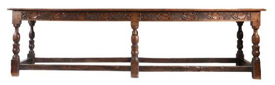 A six leg refectory table, mid-17th century manner, possibly with earlier elements The top of four