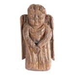 A rare 15th century oak angel mount or corbel, French, circa 1480 Carved wearing pleated robes,