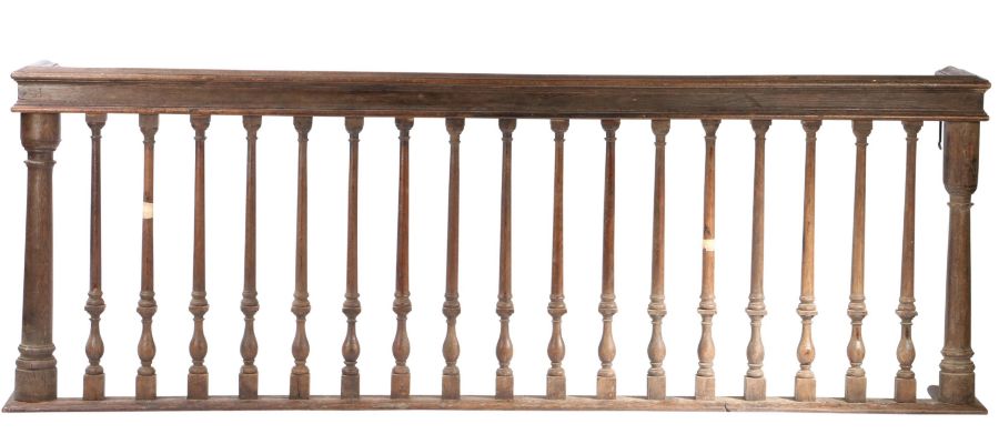 An oak alter rail, circa 1700 With gun-barrel end-posts and elegant columnar-over-balsuster turned