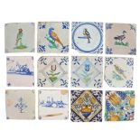 A collection of 18th Century Delft tiles, to include five with polychrome decorated tiles with