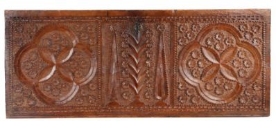 A 17th century chestnut carved chest front, Spanish Carved with a large pair of quatrefoils, centred