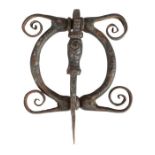 A wrought-iron door knocker, possibly early 18th century Designed as a conjoined semi-circles,