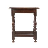 A Charles II oak joint stool, circa 1660 With ovolo-moulded top, lower chamfered edge to rails, on