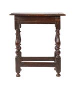 A Charles II oak joint stool, circa 1660 With ovolo-moulded top, lower chamfered edge to rails, on
