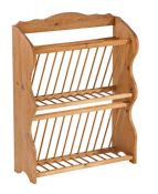 A pine plate drying rack Of two tiers, with shaped board sides, 64cm wide, 84cm high, 23cm deep