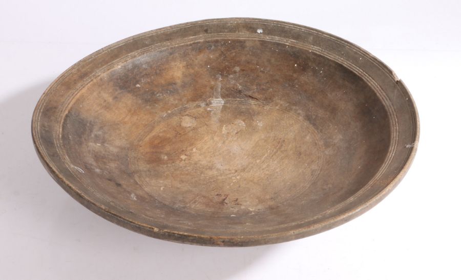 A 19th century 'sycamore' bowl With shallow footing, 37cm diameter Provenance: Doughton Manor,