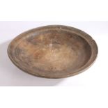 A 19th century 'sycamore' bowl With shallow footing, 37cm diameter Provenance: Doughton Manor,