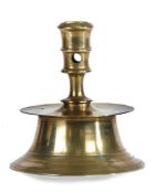 A brass capstan socket candlestick, North-West European, circa 1600 The tall socket with circular