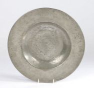 A 17th century pewter broad-rim plate, North European, circa 1650 With gentle booge, the rim