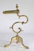 A George III brass goffering iron, circa 1780-1820 The barrel surmounted by an urn-shaped finial,