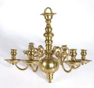 A mid-18th century brass chandelier, circa 1750 Having a knopped stem terminating in a large back