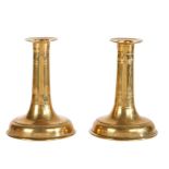 A pair of Charles II heavy brass trumpet-based candlesticks, circa 1680 Each with a broad and line-