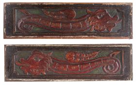 A pair of James I carved oak and rare polychrome-decorated panels, circa 1615 Each carved with an