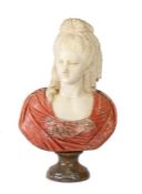 An early 19th century female bust, probably French Modelled with ringlet hair, face slightly