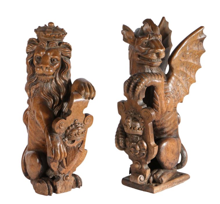 A pair of 19th century carved oak newel post finials, English Designed as supporters of Henry VIII's