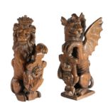 A pair of 19th century carved oak newel post finials, English Designed as supporters of Henry VIII's