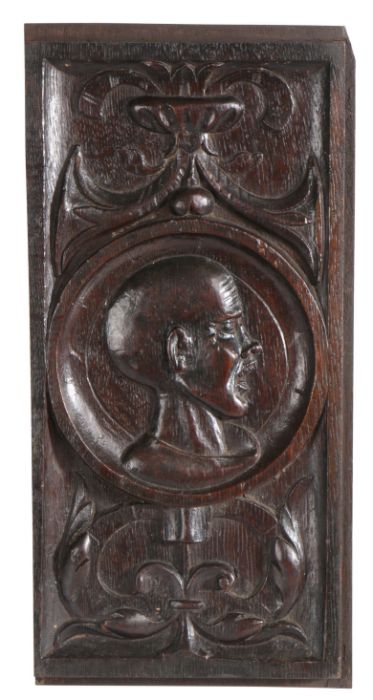 An unusual Henry VIII carved oak Romayne-type panel, circa 1530-40 Centred with the carved