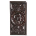 An unusual Henry VIII carved oak Romayne-type panel, circa 1530-40 Centred with the carved