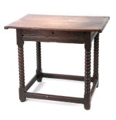 A Charles II oak side table, circa 1680, Having a twin-boarded and end-cleated top, a run-moulded