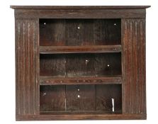 A Charles II boarded oak open glass case, circa 1670 Having three shelves, with applied moulded