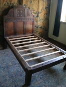 An oak bed, constructed mainly from 17th century timbers Having an arch-shaped headboard with a