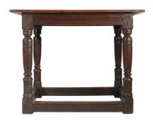 A Charles I oak centre table, circa 1630 Having a boarded and end-cleated top, and channel run-