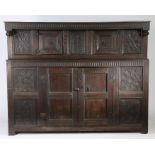 A Charles II oak court cupboard, circa 1660 Having a slender nulled-carved frieze with end-pendants,