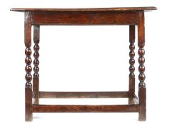 A Charles II elm and oak centre table, circa 1680 The well-figured elm top formed principally from