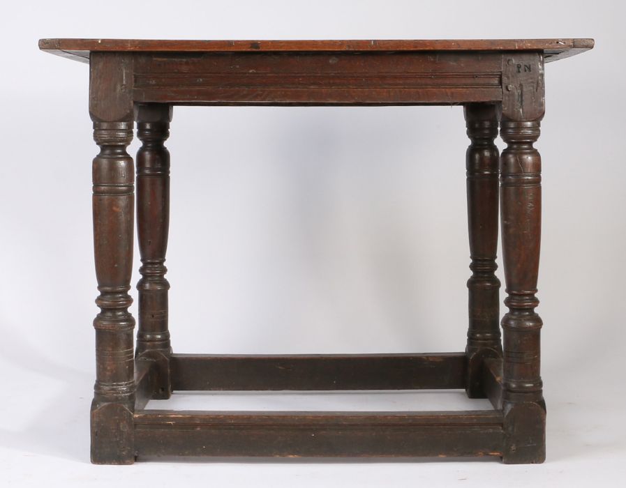 A Charles I oak centre table, circa 1630 Having a boarded and end-cleated top, and channel run- - Image 3 of 4