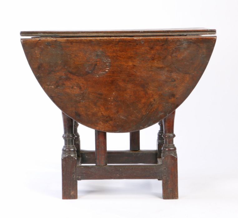 An oak table stool: a rare Elizabeth I oak joint stool, circa 1580, with a 17th century oval drop- - Image 6 of 8