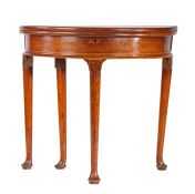 A George II fold-over demi-lune table, circa 1720 The circular top supported on a rear gate, the