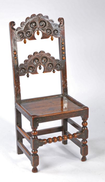 A Charles II oak backstool, Yorkshire, circa 1670 Having a pair of arched splats, each carved with - Image 4 of 4