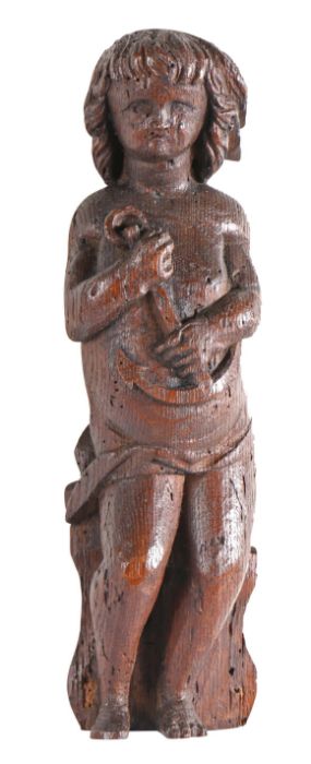 A late 16th/early 17th century carved oak figure of Hope Designed standing, holding an anchor,