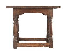 An Elizabeth I oak centre table, circa 1600 Having a one-piece top board with end-cleats, all
